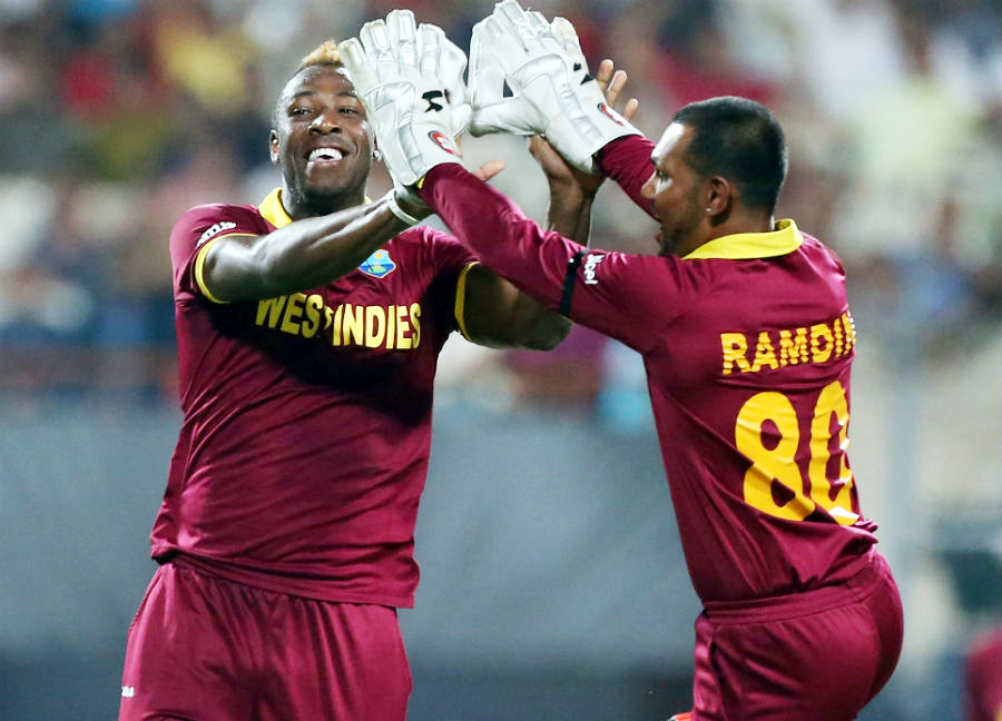 Andre Russell and Denesh Ramdin celebrate the wicket of Alex Hales during the World T20 final match between England and West Indies in Kolkata on Sunday.
