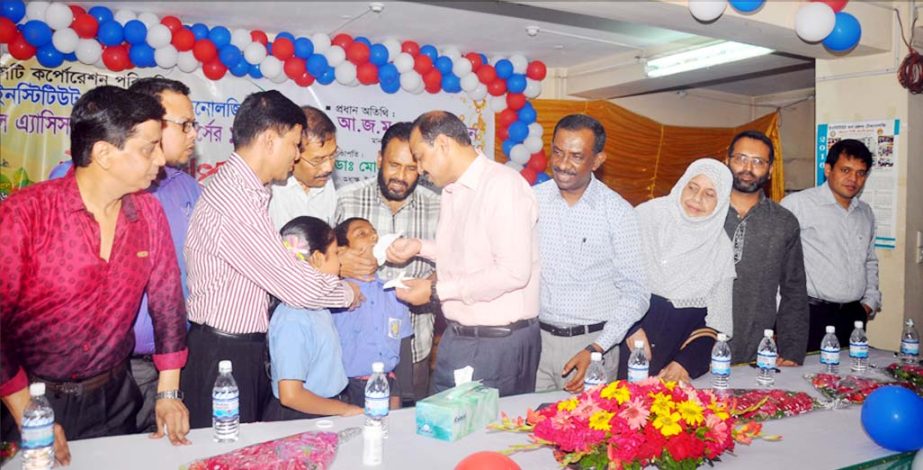 CCC Mayor A J M Nasir Uddin giving deworming tablets to a child marking the inaugurating of the National Deworming Week on Saturday.