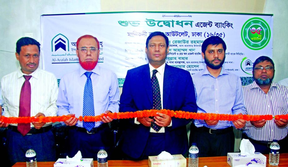 Md. Rezaur Rahman, Deputy Managing Director of Al-Arafah Islami Bank Limited, inaugurating an Agent Banking Outlet at Manikdi Bazaar, Dhaka recently.