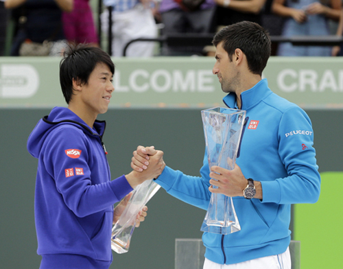 Novak Djokovic of Serbia (right) and Kei Nishikori of Japan congratulate each other after their men's singles final match at the Miami Open tennis tournament in Key Biscayne, Fla on Sunday. Djokovic won 6-3, 6-3.
