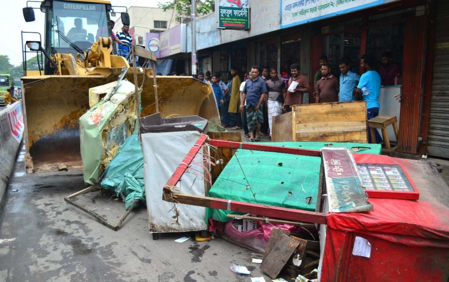 Dhaka South City Corporation demolished illegal establishments in city's Chandkharpool area and also makeshift-shops from footpaths on Monday.