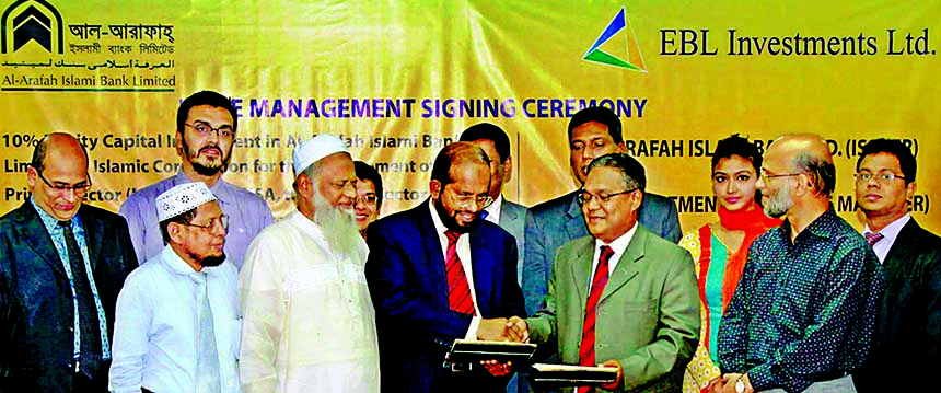 Moinul Hossain Asif, Managing Director, EBL Investments Ltd. a subsidiary institution of Eastern Bank Ltd and Md Habibur Rahman, Managing Director of Al-Arafah Islami Bank Ltd, exchanging documents in Dhaka recently. Under the agreement, EBLIL will work a