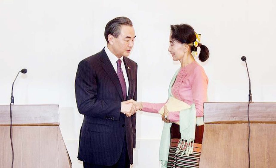 Myanmar's Foreign Minister Aung San Suu Kyi shaking hands with Chinese Foreign Minister Wang Yi in Naypyitaw.