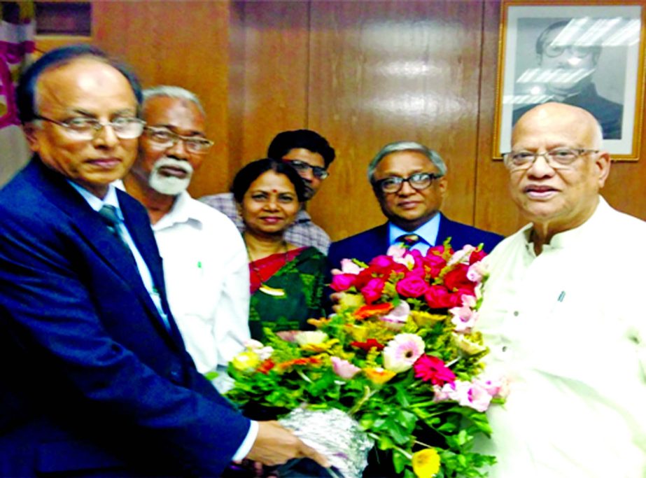 Chairman of Bangladesh Krishi Bank (BKB), Mohammad Ismail greets Finance Minister Abul Maal A Muhith MP, for being awarded with "Independence Award-2016" recently. Managing Director of BKB, M A Yousoof was present on the occasion among others.