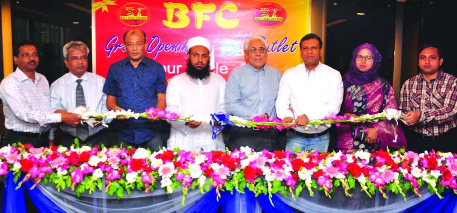 Anisur Rahman Sinha, Chairman of Opex and Sinha Group, inaugurating the 15th branch of Best Fried Chicken (B.F.C.) at Mirpur-10 in the city recently. Nizamul Karim Chowdhury, Executive Director of BFC, among others, was present.