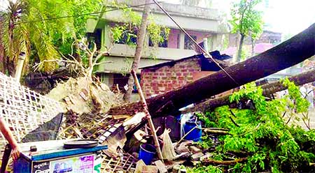 Nor'wester that lashes over Khulna, Jessore and other adjacent areas leaving four people dead and injures about 100. Photo shows several houses damages and trees uprooted on Tuesday night. This photo was taken from Khulna on Wednesday.