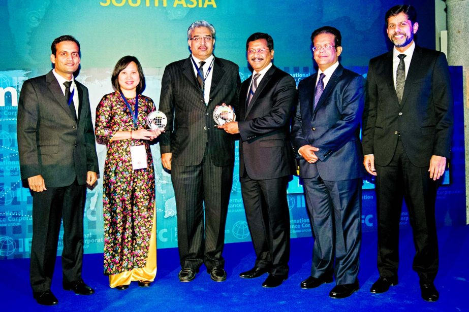 Md Mehmood Husain, Managing Director of Bank Asia, receives ``The Best Partner Bank of International Finance Corporation (IFC) in South Asia Region" award from Anurag Mishra, Regional Head of Global Trade and Short Term Finance, Asia Pacific Region at th