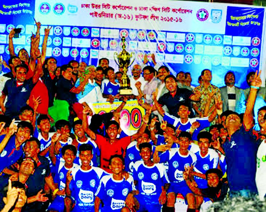 Members of Arambagh Football Academy, the champions of the Dhaka North City Corporation and Dhaka South City Corporation Pioneer Football League with the guests and the officials of Bangladesh Football Federation pose for a photo session at the Bangabandh