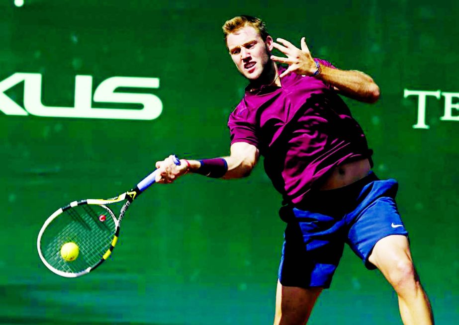 Jack Sock of the United States returns a shot to Matthew Barton of Australia at the US Men's Clay Court Championship tennis tournament in Houston on Thursday. Sock won 6-2, 7-6.