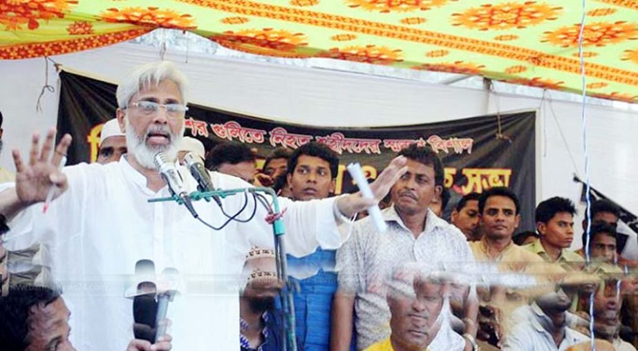 Former city mayor Mahmudul Islam Chowdhury addressing local people at Gandamara under Banskhali on Friday.