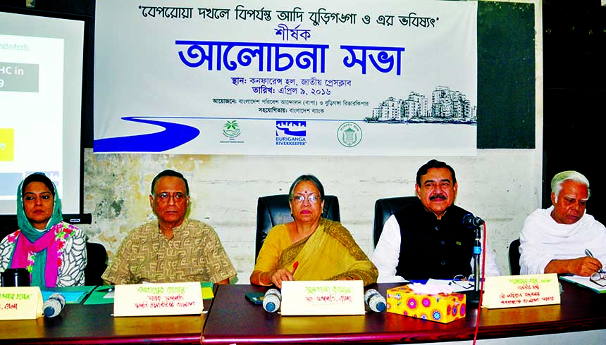 Shipping Minister Shahjahan Khan along with other distinguished persons at a discussion on 'Encroachment on Adi Buriganga and its future' organized by different organisations including Bangladesh Paribesh Andolon at Jatiya Press Club on Saturday.