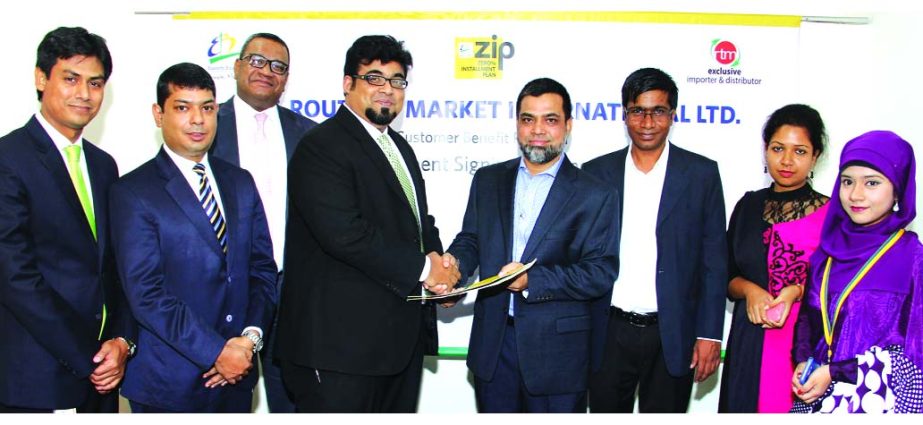 M. Nazeem A. Choudhury, Head of Consumer Banking of Eastern Bank Ltd (EBL) and Zulfiker Ali Siddique, Managing Director of Route to Market International Ltd (RTM) exchange documents after signing a Zero percent installment facility (ZIP) agreement in Dhak