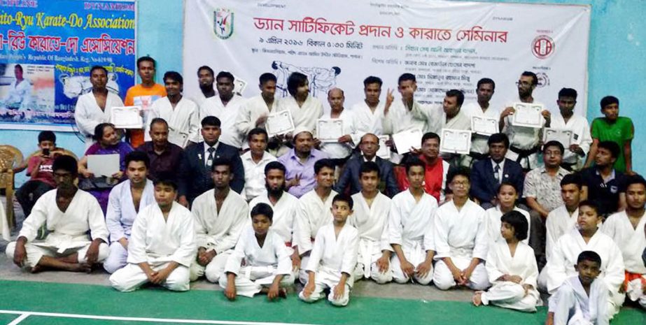 The participants of the karate seminar and certificate distribution programme pose for a photo session at the Gymnasium of Shaheed Advocate Amin Uddin Stadium in Pabna on Saturday.
