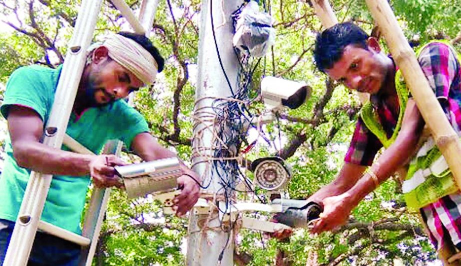Members of law-enforcing agencies are seen installing CC cameras at the Suhrawardy Udyan area ahead of Pahela Baishakh celebration. This photo was taken on Monday.