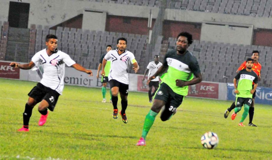 An action from the football match of the KFC Independence Cup between Team BJMC and Arambagh Krira Sangha at the Bangabandhu National Stadium on Tuesday.