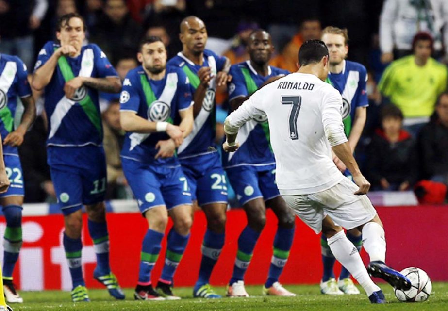 Real Madrid's Cristiano Ronaldo scores his side's 3rd goal during the Champions League 2nd leg quarterfinal soccer match between Real Madrid and VfL Wolfsburg at the Santiago Bernabeu stadium in Madrid, Spain on Tuesday.