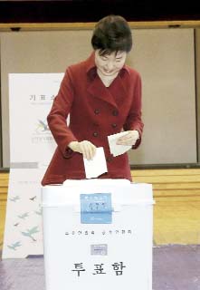 South Korean President Park Geun-hye casts her ballot for parliamentary elections at a polling station in Seoul, South Korea on Wednesday.