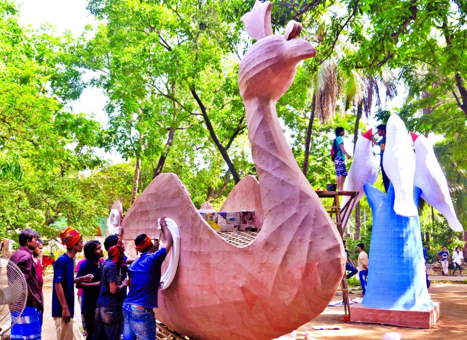 The students of Faculty of Fine Arts of Dhaka University on Wednesday are putting finishing touches to their artworks as they are set to bring out Mangal Sobhajatra, a procession seeking well-being of all.