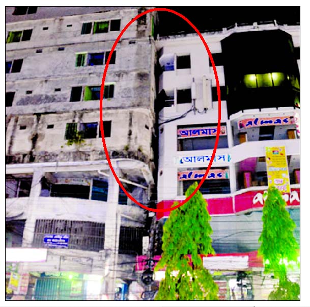 A 4-storey building tilted on another 6-storey building at Amtoly, Chittagong due to impact of the earthquake.