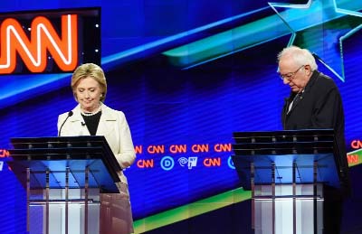 Democratic Presidential candidates Sen. Bernie Sanders, I-Vt., (right), and Hillary Clinton speak during the CNN Democratic Presidential Primary Debate at the Brooklyn Navy Yard on Thursday