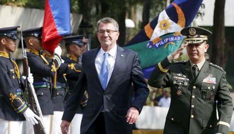 US Defence Secretary Ash Carter walks past honour guards at Camp Aguinaldo to attend the closing ceremony of a U.S.-Philippine military exercise dubbed "Balikatan" (shoulder to shoulder) in Quezon City, Metro Manila on Friday.