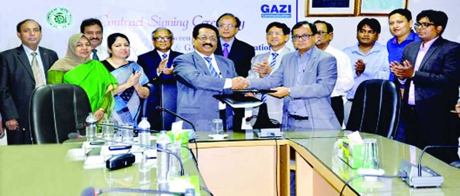Mohiuddin Dewan, DGM of ICT division of Bangladesh Krishi Bank and Shahriar M Sina, CEO of Gazi Communications sign a contract to ensure cyber security for data centre of the bank at the bank's head office in the city recently. The Chairman of the Board