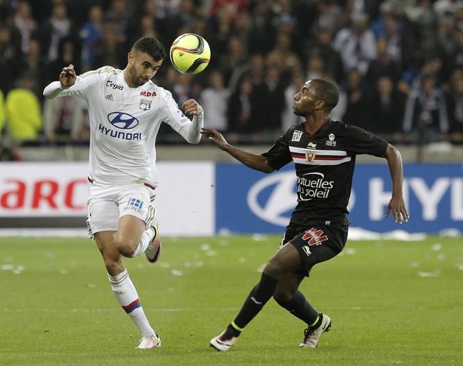 Lyon's Rachid Ghezzal (left) challenges for the ball with Nice's Ricardo Barbosa Pereira, during their French League One soccer match in Decines, near Lyon, central France on Friday.