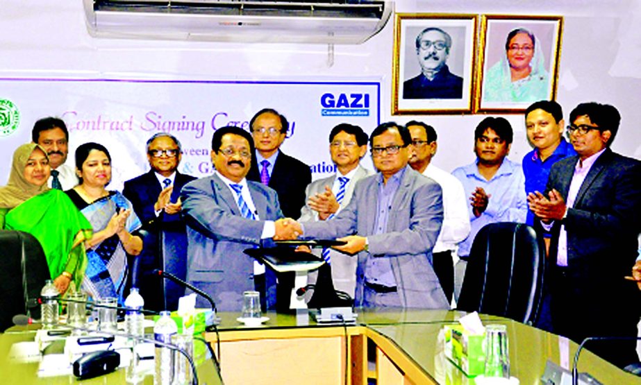 Bangladesh Krishi Bank (BKB) signs a contract with Gazi Communications to ensure cyber security for data centre of the bank in the city recently. Mohiuddin Dewan, DGM of ICT, BKB and Shahriar M Sina, CEO of Gazi Com sign the contract on behalf of their re