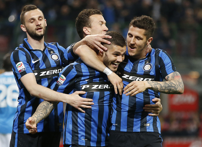 Inter Milan's Mauro Icardi (center bottom) celebrates with his teammates Stevan Jovetic, (right) Inter Milan's Marcelo Brozovic (left) and Ivan Perisic after scoring during the Serie A soccer match between Inter Milan and Napoli at the San Siro stadium