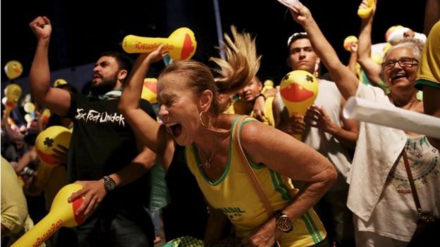 Dilma Rousseff's opponents - many of them dressed in yellow and green - celebrated across the country, such as here in Sao Paulo