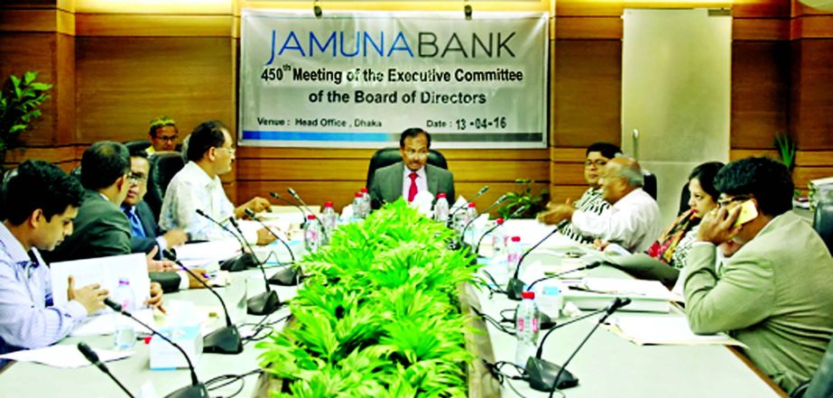 Nur Mohammed, Chairman, Executive Committee, Jamuna Bank Limited and Chairman, Jamuna Bank Foundation presiding over the 450th EC meeting at its head office recently. Md Sirajul Islam Varosha, Chairman of the Board of Directors of the bank including other