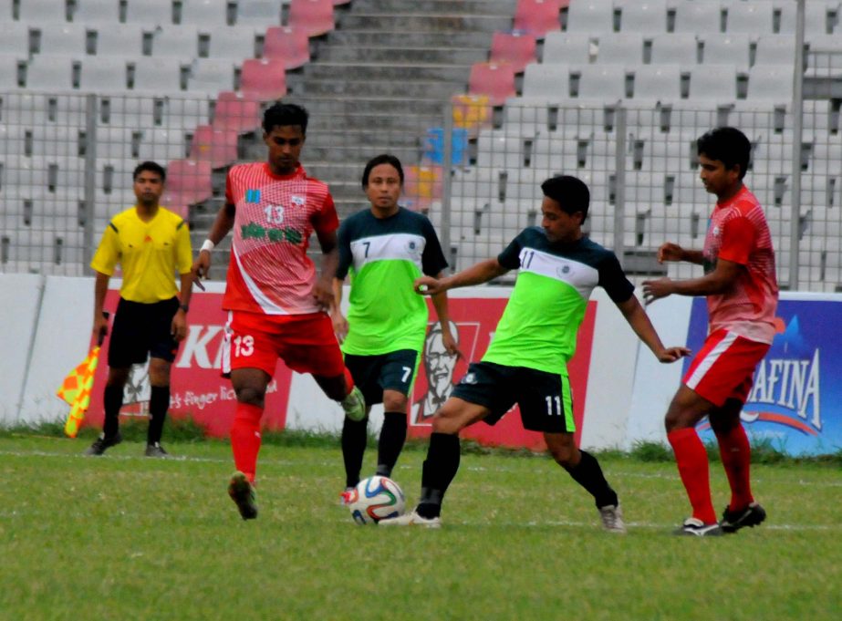 An action from the football match of the KFC Independence Cup between Team BJMC and Soccer Club. Feni at the Bangabandhu National Stadium on Monday.