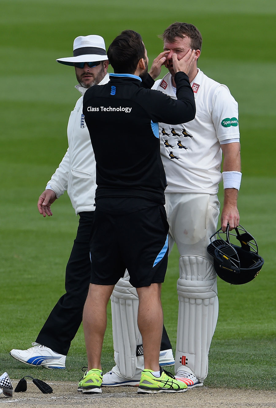 Chris Nash gets checked over by the physio on third day of Division Two match between Sussex and Essex in County Championship at Hove on Tuesday.