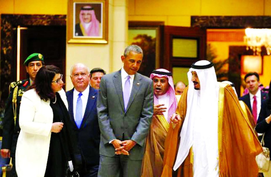 US President Barack Obama and Saudi King Salman walk together following their meeting at Erga Palace in Riyadh, Saudi Arabia on Wednesday.