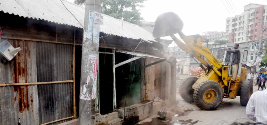 Illegal structures are evicting beside Mirza Canal at Panchlaish Thana area on Tuesday.