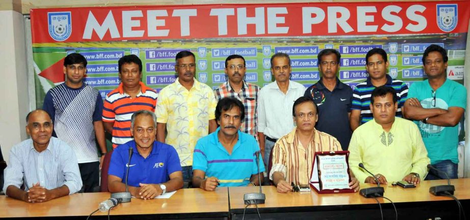 The newly elected Football Coaches Association of Bangladesh pose for a photo session at the conference room of Bangladesh Football Federation House on Thursday.