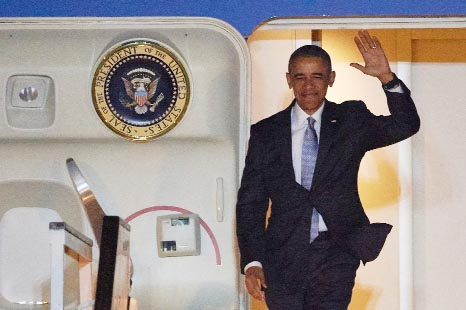 US President Barack Obama leaves Air Force One after landing at Stansted Airport near London on Thursday..