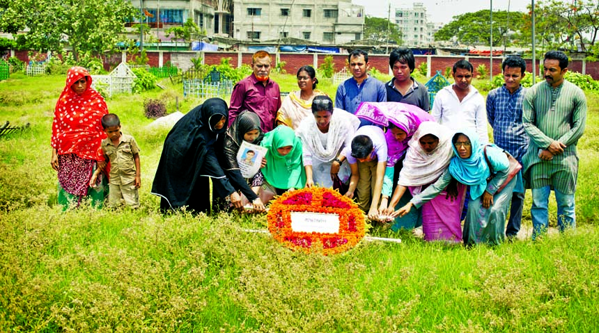 Different organisations and family members of Rana Plaza victims placing floral wreaths at their graves in the city's Jurain Graveyard on Saturday marking three years to Rana Plaza collapse.