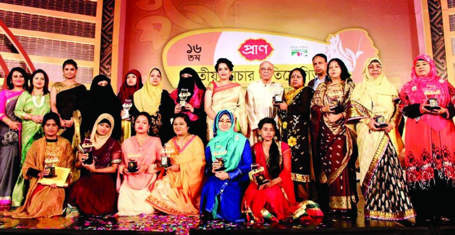 Selima Ahmed, President, Women Chamber of Commerce and Industry and Director (Corporate Finance), Pran-RFL Group Uzma Chowdhury and Channel-1 Executive Director Israrul Haque seen with the winners of Pran National Pickle Competition held at Bangabandhu In