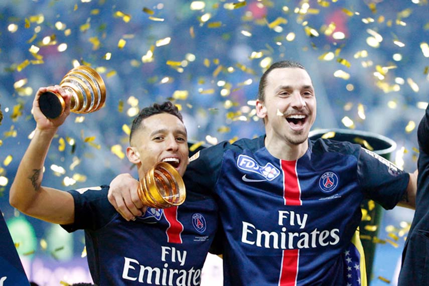 PSG's Zlatan Ibrahimovic (right) and Marquinhos celebrate after winning the League Cup final soccer match between Paris Saint Germain and Lille at the Stade de France stadium in Saint Denis, north of Paris on Saturday.