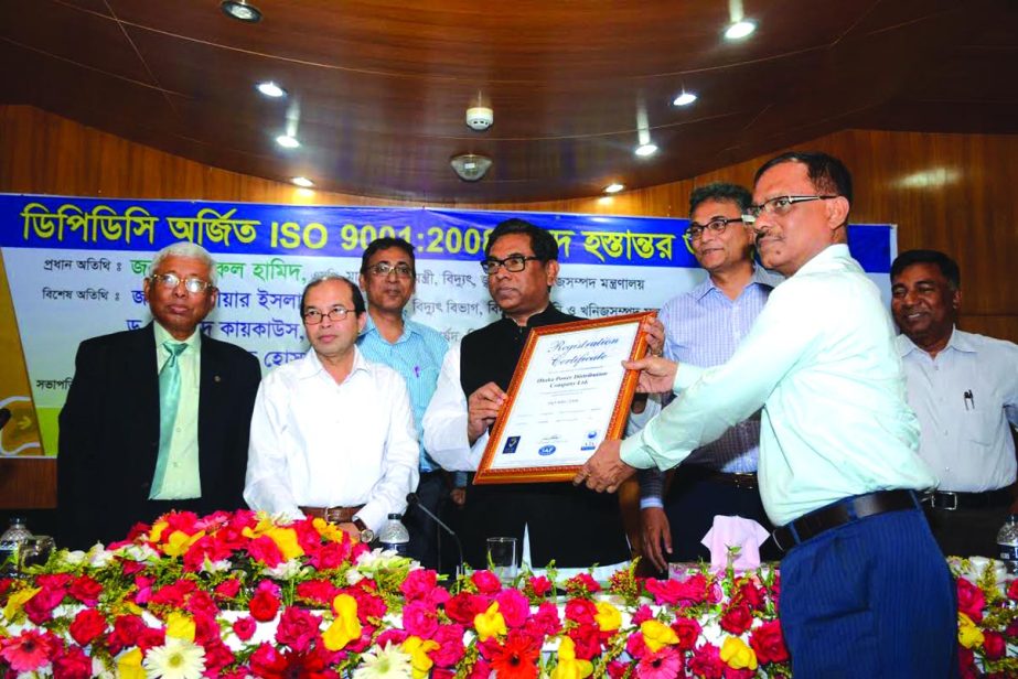 State Minister for Power, Energy and Mineral Resources Nasrul Hamid hands over the ISO: 9001: 2008 Certificate to Brig. General Nazrul Hasan (Retd.), Managing Director of Dhaka Power Distribution Company Limited (DPDC), at a programme in the capital recen