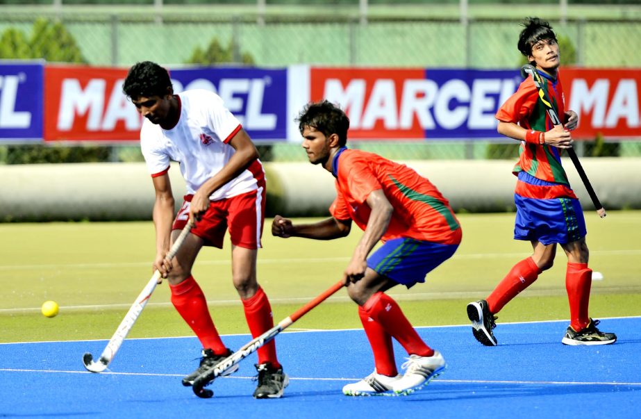 A moment of the match of the Marcel Club Cup Hockey Competition between Usha Krira Chakra and Ajax SC at the Moulana Bhashani National Hockey Stadium on Tuesday.