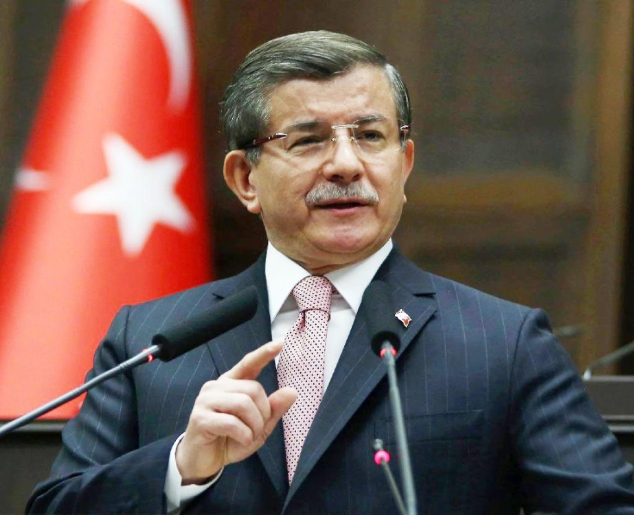 Prime Minister Ahmet Davutoglu has pledged that Turkey's draft constitution will guarantee secularism .
