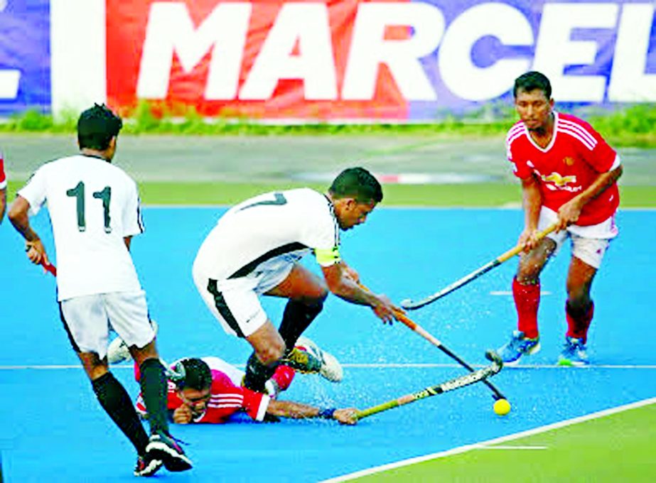An exciting moment of the match of the Marcel Club Cup Hockey Competition between Dhaka Mohammedan Sporting Club Limited and Sonali Bank SRC at the Moulana Bhashani National Hockey Stadium on Friday.
