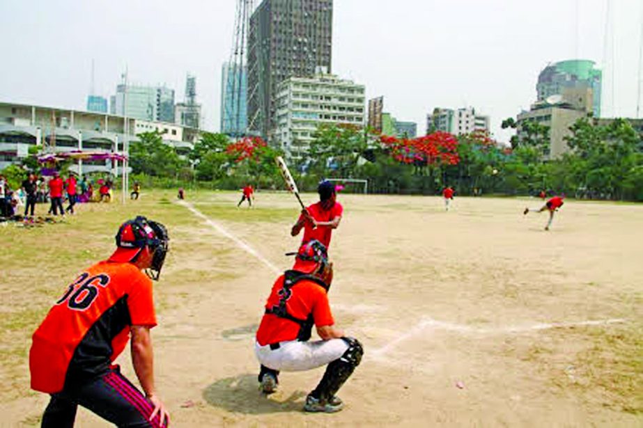 An action from the friendly baseball match between Bangladesh Baseball team and Japanese Samurai team at the Paltan Maidan on Friday.