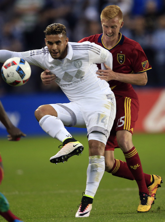 Sporting Kansas City forward Dom Dwyer (14) handles the ball while covered by Real Salt Lake defender Justen Glad (15) during the first half of an MLS soccer match in Kansas City, Kan. on Saturday.