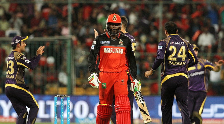 Chris Gayle walks back after being dismissed for 7 on his return to the side during the IPL match between Royal Challengers Bangalore (RCB) and Kolkata Knight Riders at Bangalore on Monday. RCB scored 185 for 7 in their 20 overs.