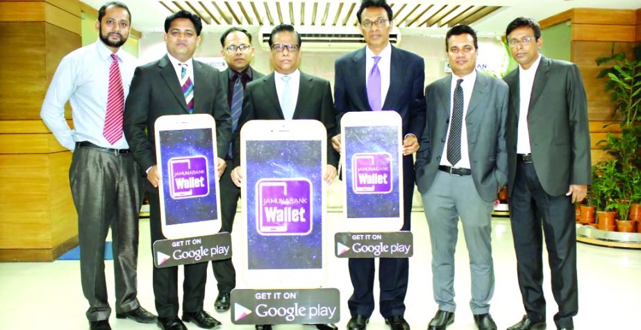 Managing Director & CEO Shafiqul Alam, Deputy Managing Director A. K. M. Saifuddin Ahamed of Jamuna Bank along with other high officials pose after launching "Jamuna Bank Wallet", a re-branded mobile application for banking services recently.