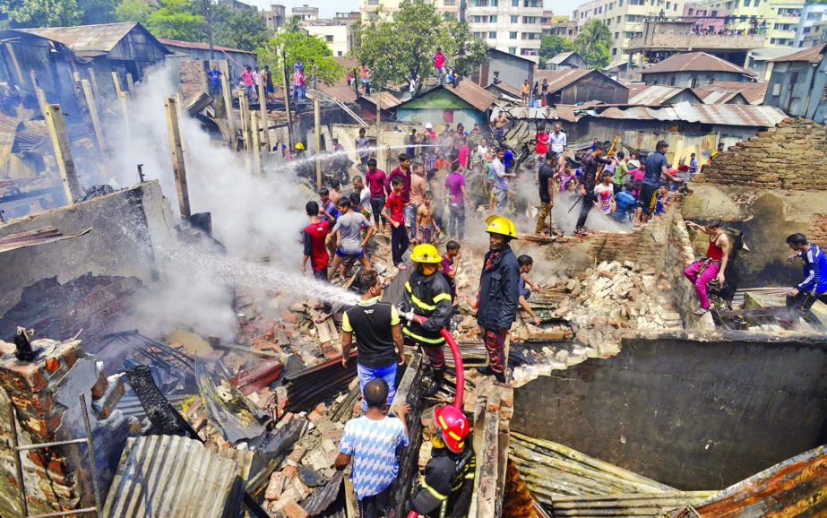 50 shanties were gutted when a devastating fire that broke out at Amtali slum at Razabazar behind Green Super Market in Farmgate area on Wednesday.