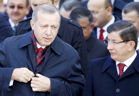 Turkey's President Tayyip Erdogan (L) chats with Prime Minister Ahmet Davutoglu during a Republic Day ceremony at Anitkabir, the mausoleum of modern Turkey's founder Ataturk, in Ankara, Turkey.